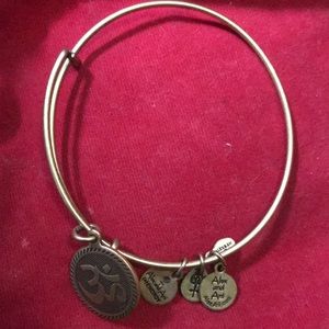 2 bangle bracelets with charms